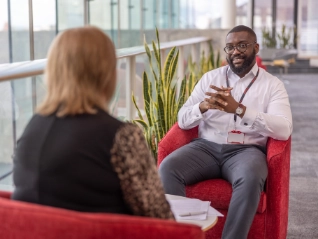 Atradius colleagues having a face to face office meeting
