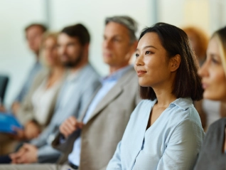 woman in group listening attentively