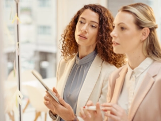 two women at a board