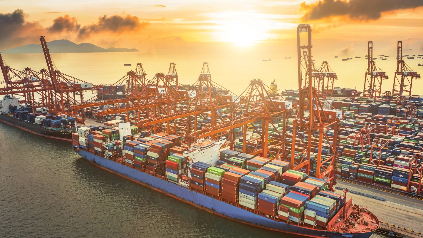 Aerial view of large ship in dock with containers image
