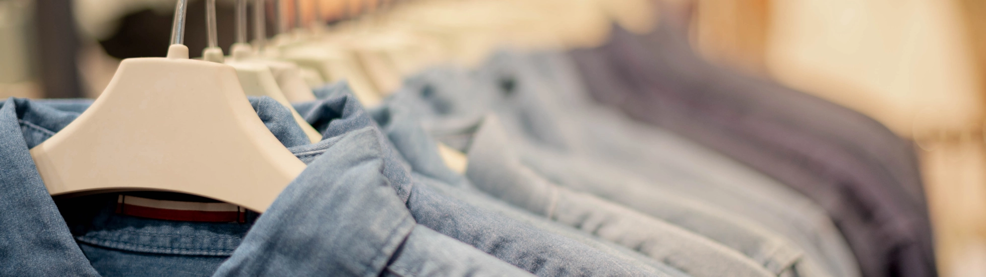 A clothes rack of men's shirts hanging up